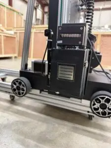 WP-UV-PRO printhead carriage assembly showing the Epson i3200 printhead, UV LED curing lamp, patented pump box, and drive motor mounted on the wheeled rail system