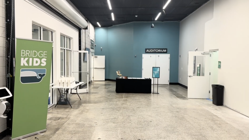Church lobby at The Bridge Church in Wilmington, NC, before wall graphics and wayfinding were added