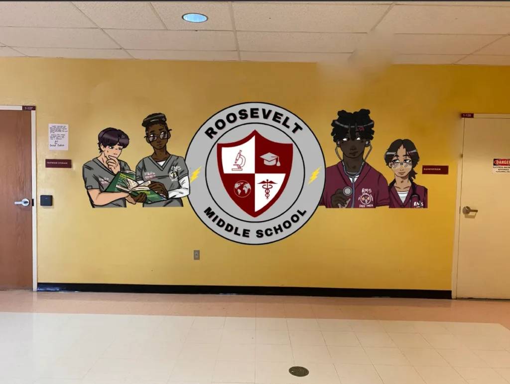 A school crest and illustrated students printed on a yellow school hallway wall