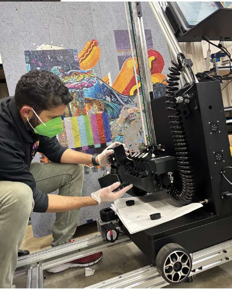 Operator's hands adjusting the printer carriage