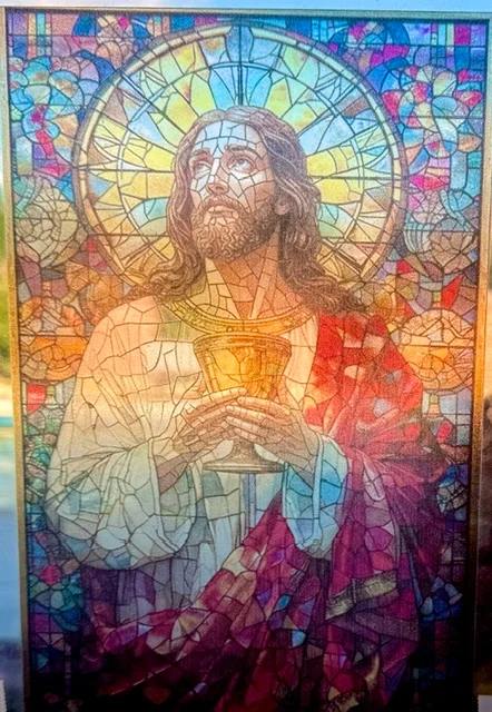A stained glass style portrait printed on a panel