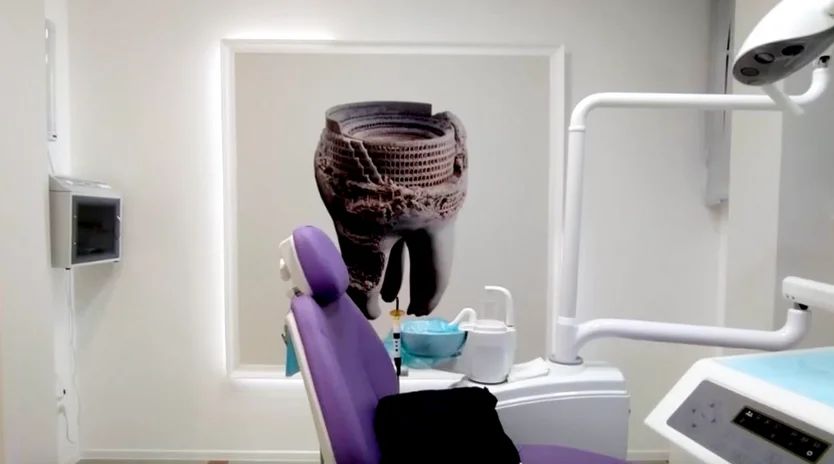 Artwork printed on the wall behind a dental chair