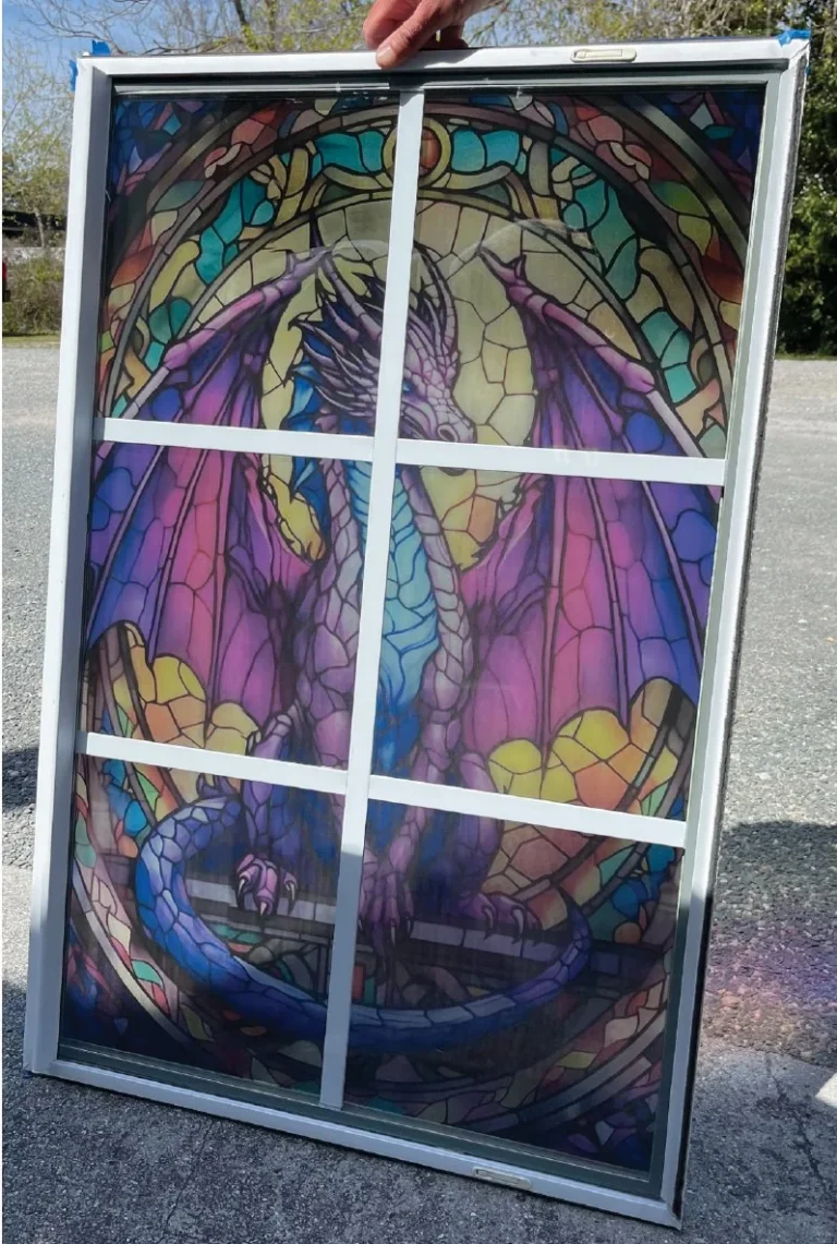 Dragon design printed onto a glass window to look like stained glass