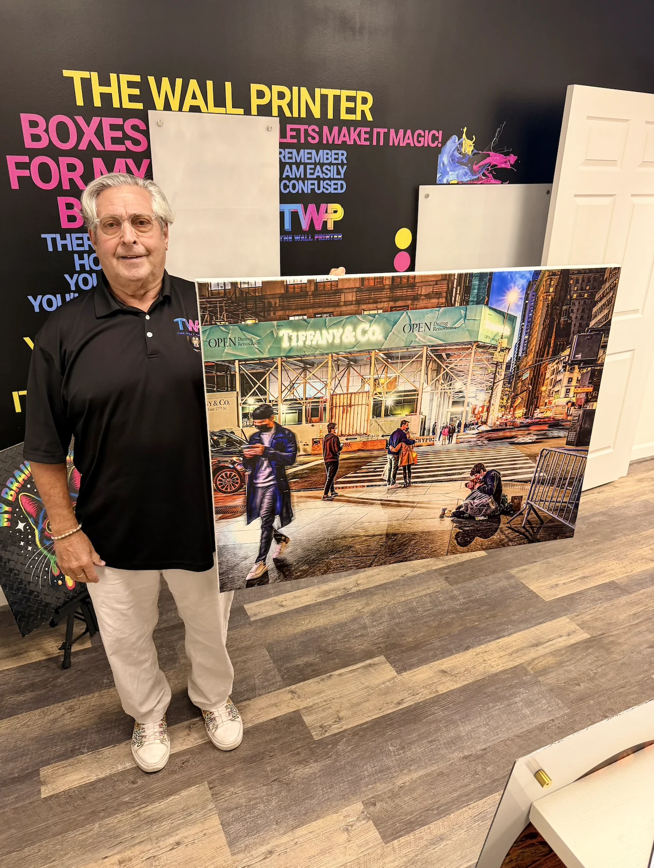 A large printed panel of a New York street photo held up in The Wall Printer showroom in Wilmington, NC