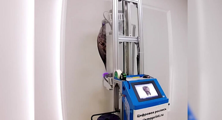 The vertical printer printing artwork on a wall in a dental treatment room