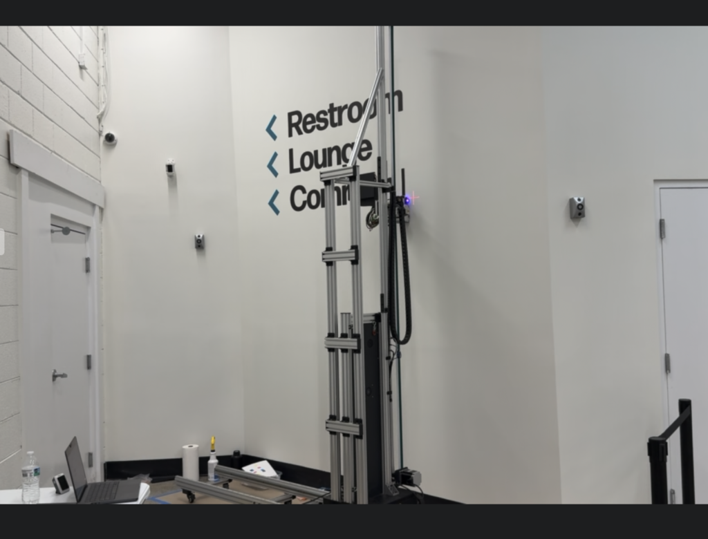 Vertical wall printer printing directional wayfinding for the restroom, lounge, and common area at The Bridge Church
