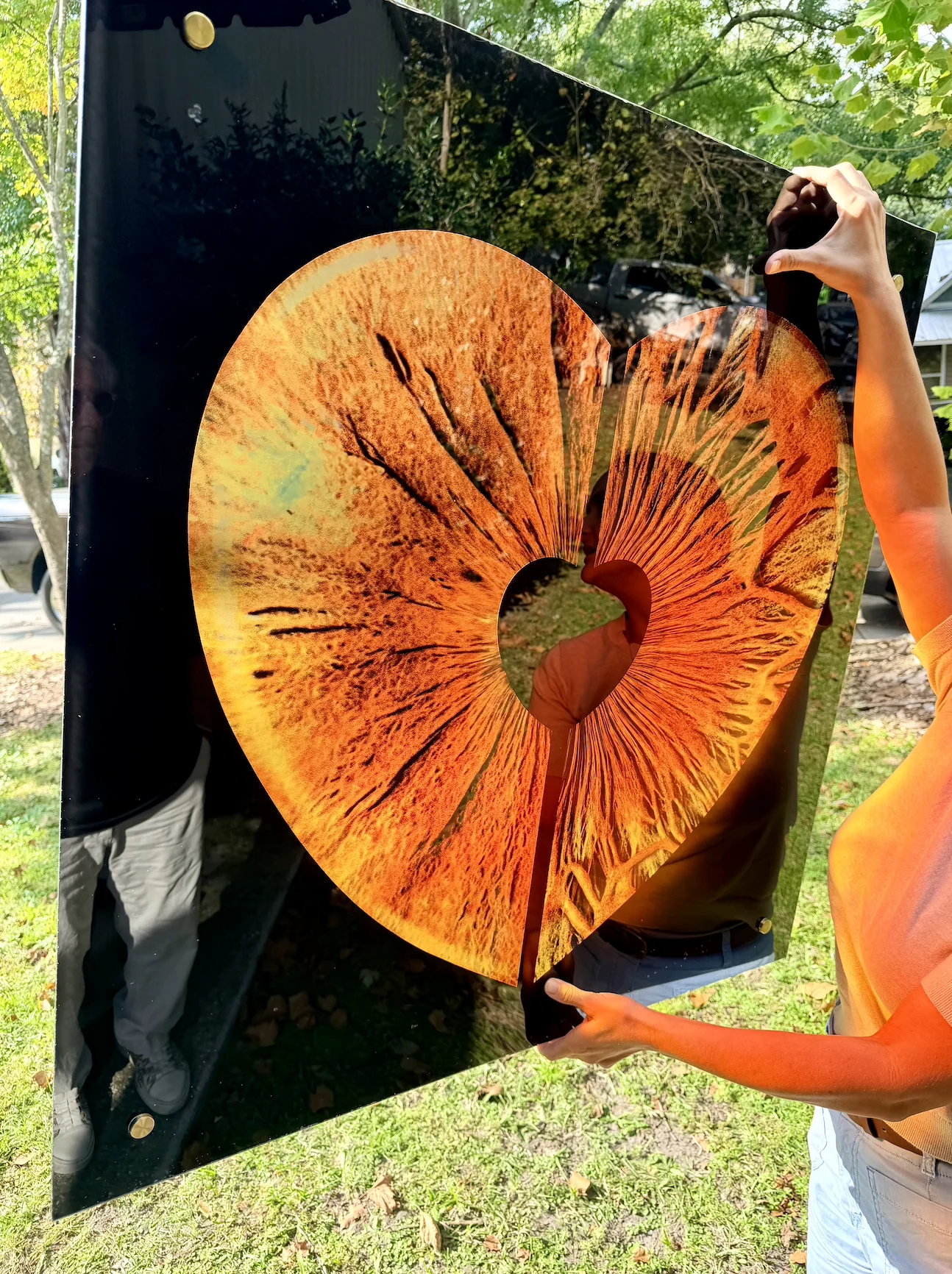 A heart-shaped iris photo printed on a glossy black acrylic panel by Wilmington Wall Printing